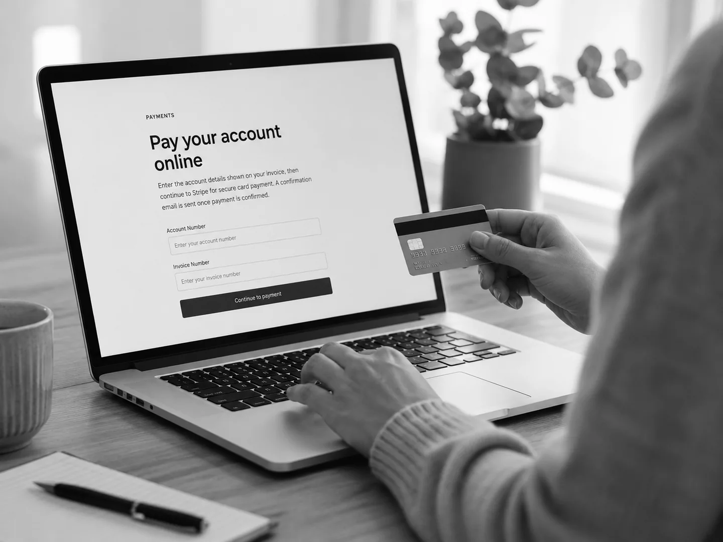 Person preparing to pay a Clinics GRP invoice securely online by card.